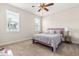 Bright bedroom with a pink headboard, large window, and a side table at 2014 Anna Lilley Dr, Fuquay Varina, NC 27526