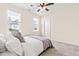 Cozy bedroom featuring natural light, a ceiling fan, and neutral decor for a peaceful atmosphere at 2014 Anna Lilley Dr, Fuquay Varina, NC 27526