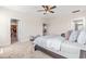 Bedroom featuring a gray bed with soft pillows, carpet floors, and a walk-in closet at 2014 Anna Lilley Dr, Fuquay Varina, NC 27526