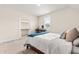 Comfortable bedroom with a double bed, bright window, and closet and desk in the background at 2014 Anna Lilley Dr, Fuquay Varina, NC 27526