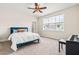 Cozy bedroom featuring a plush bed, ceiling fan and a view of the outside at 2014 Anna Lilley Dr, Fuquay Varina, NC 27526