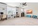 Spacious bonus room featuring built-in shelving, a ceiling fan, and a play area at 2014 Anna Lilley Dr, Fuquay Varina, NC 27526