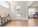 Welcoming foyer with natural light, a decorative console table, and hardwood flooring at 2014 Anna Lilley Dr, Fuquay Varina, NC 27526