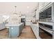 Stylish kitchen with a large island, modern appliances, sleek countertops, and ample cabinet space at 2014 Anna Lilley Dr, Fuquay Varina, NC 27526