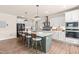 Spacious kitchen with an oversized island, seating, modern appliances, and views of the dining area at 2014 Anna Lilley Dr, Fuquay Varina, NC 27526