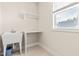 Functional laundry room with a utility sink, work surface, and a bright window at 2014 Anna Lilley Dr, Fuquay Varina, NC 27526