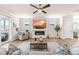 Spacious living room showcasing a modern fireplace, ceiling fan, and a cozy seating arrangement at 2014 Anna Lilley Dr, Fuquay Varina, NC 27526