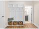Well-organized mudroom with built-in storage, a bench, and easy access to an adjacent bathroom at 2014 Anna Lilley Dr, Fuquay Varina, NC 27526