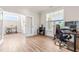 Bright home office featuring wood floors, a large window, and a comfortable workspace perfect for productivity at 2014 Anna Lilley Dr, Fuquay Varina, NC 27526
