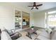 Relaxing covered patio with comfortable seating, a ceiling fan, and view into the living room at 2014 Anna Lilley Dr, Fuquay Varina, NC 27526