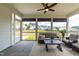 Screened porch with comfortable seating and open views of the backyard and neighborhood at 2014 Anna Lilley Dr, Fuquay Varina, NC 27526