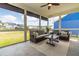 Relaxing sunroom featuring comfortable seating, ceiling fan and views of the backyard at 2014 Anna Lilley Dr, Fuquay Varina, NC 27526