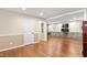 Large finished basement featuring hardwood floors, modern lighting and fireplace at 204 Random Ln, Burlington, NC 27215
