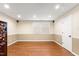 Spacious unfinished basement with hardwood floors and natural lighting at 204 Random Ln, Burlington, NC 27215