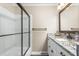 Stylish bathroom with granite vanity, shower with glass door, and contemporary fixtures at 204 Random Ln, Burlington, NC 27215