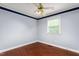Bedroom featuring hardwood floors, ceiling fan, and window with blinds at 204 Random Ln, Burlington, NC 27215