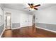 Bedroom featuring hardwood floors, chair rail, and closet at 204 Random Ln, Burlington, NC 27215