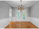 Elegant dining room with hardwood floors, chandelier, and views to adjacent rooms at 204 Random Ln, Burlington, NC 27215