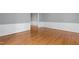 Spacious living room with hardwood floors, neutral walls, and detailed wainscoting at 204 Random Ln, Burlington, NC 27215