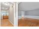 Open floor plan featuring hardwood floors and classic molding, leading to the kitchen at 204 Random Ln, Burlington, NC 27215