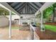 Outdoor kitchen featuring a built-in grill, sink, and countertop space for food preparation at 204 Random Ln, Burlington, NC 27215