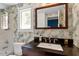 Stylish bathroom featuring modern fixtures, a vanity with great counterspace, and wallpaper at 216 N Bloodworth St, Raleigh, NC 27601