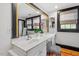 Well-lit bathroom with double sinks, ample counter space, and large mirror at 216 N Bloodworth St, Raleigh, NC 27601