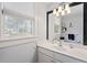Well-lit bathroom with a modern vanity and a large mirror, enhancing the sense of space at 216 N Bloodworth St, Raleigh, NC 27601