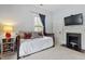 This bedroom features soft blue walls, classic fireplace, and convenient side table at 216 N Bloodworth St, Raleigh, NC 27601