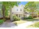 Charming two-story home with a lovely front porch and mature trees providing shade at 216 N Bloodworth St, Raleigh, NC 27601