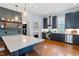 Beautiful kitchen with island, stainless steel appliances, and hardwood floors at 216 N Bloodworth St, Raleigh, NC 27601