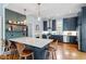 Modern kitchen with a large island, stainless steel appliances, and open shelving at 216 N Bloodworth St, Raleigh, NC 27601
