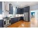 Bright kitchen with stainless steel appliances, custom cabinets and marble countertops at 216 N Bloodworth St, Raleigh, NC 27601