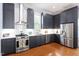 Modern kitchen with shaker cabinets, stainless steel appliances, and ample counter space, perfect for cooking and entertaining at 216 N Bloodworth St, Raleigh, NC 27601