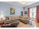 Cozy living room features neutral colored walls, hardwood floors, and lots of natural light at 216 N Bloodworth St, Raleigh, NC 27601