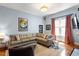 Inviting living room with a sectional sofa, complemented by an elegant light fixture and stylish decor at 216 N Bloodworth St, Raleigh, NC 27601