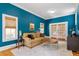 Bright living room with hardwood floors, a comfortable sofa, and French doors at 216 N Bloodworth St, Raleigh, NC 27601