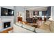 Cozy living room with a fireplace and an open view into the modern kitchen at 216 N Bloodworth St, Raleigh, NC 27601