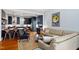 Open-concept living room and kitchen with stainless steel appliances and hardwood floors at 216 N Bloodworth St, Raleigh, NC 27601