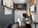 The modern office features built-in shelving, herringbone floors, and chic, contrasting paint at 216 N Bloodworth St, Raleigh, NC 27601