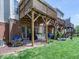Spacious backyard featuring a covered wooden deck, patio, and green lawn at 216 Ruby Walk Dr, Morrisville, NC 27560