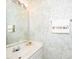 Well-lit bathroom featuring a single sink vanity and decorative wallpaper at 216 Ruby Walk Dr, Morrisville, NC 27560
