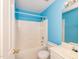 Bathroom with blue walls, a white tub and shower combo, and vanity at 216 Ruby Walk Dr, Morrisville, NC 27560