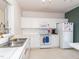 This kitchen features white cabinets, stainless steel appliances, and lots of counter space at 216 Ruby Walk Dr, Morrisville, NC 27560