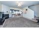Open-concept living room with a fireplace, seamlessly connected to the dining area at 216 Ruby Walk Dr, Morrisville, NC 27560