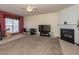 Cozy living room with fireplace, a neutral color palette, and a ceiling fan at 216 Ruby Walk Dr, Morrisville, NC 27560