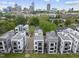 Aerial view of a residential neighborhood with modern architecture and lush greenery at 221 Woodsborough Pl, Raleigh, NC 27601