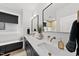 Elegant bathroom with dual sinks, modern fixtures, and ample counter space at 221 Woodsborough Pl, Raleigh, NC 27601
