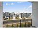 Street view highlighting a row of modern homes at 221 Woodsborough Pl, Raleigh, NC 27601