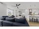 Spacious open-concept design featuring a stylish living room leading into the kitchen at 221 Woodsborough Pl, Raleigh, NC 27601